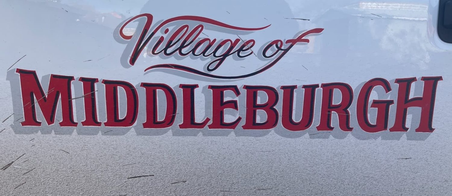 Picture of a red "Village of Middleburgh" decal on a white truck