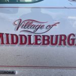 Picture of a red "Village of Middleburgh" decal on a white truck